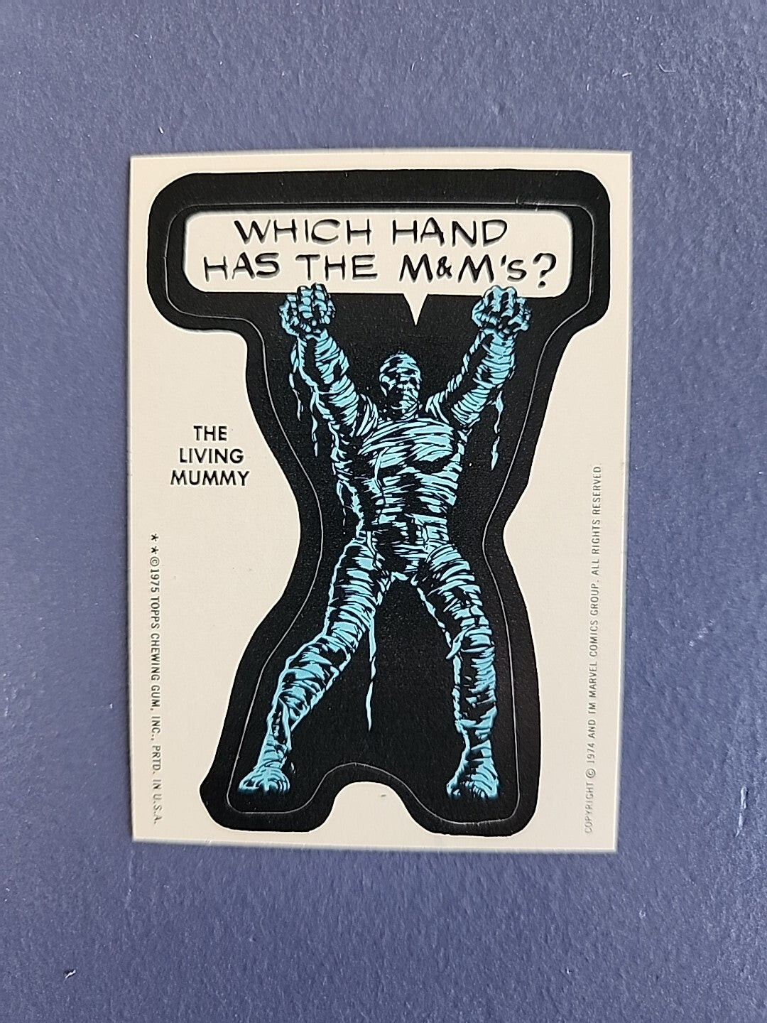1975 TOPPS MARVEL COMIC STICKER, LIVING MUMMY, WHICH HAND HAS THE M&MS