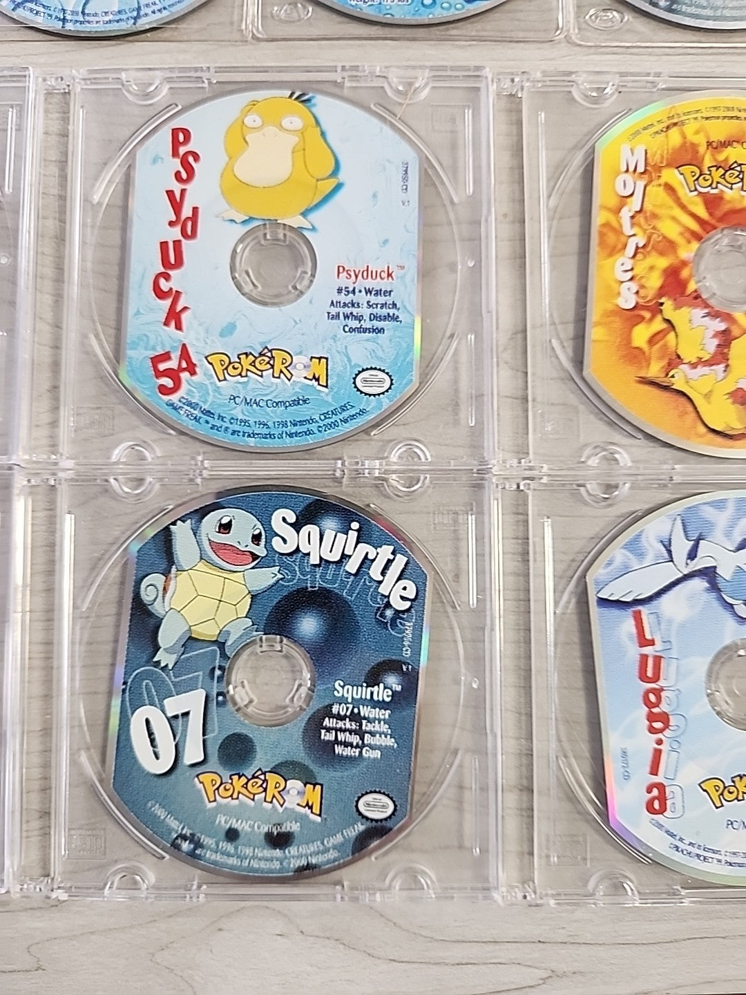 Pokemon PokeRom CD-ROM Lot Of 14 Bulbasaur Gengar Squirtle Lugia Hoothoot Ledyba